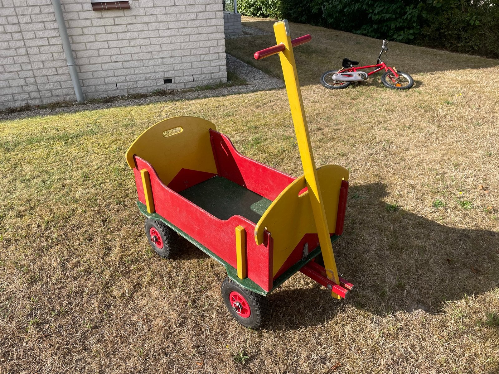 Houten bolderkar, rood en geel, Ophalen, Gebruikt