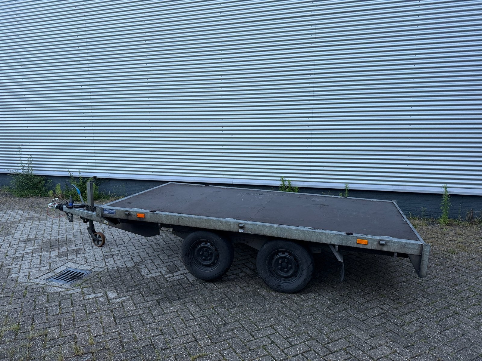 Platte aanhanger tandemas, Ophalen, Gebruikt