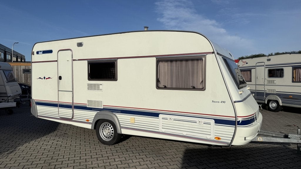 Wilk Stern 490 TKM bouwjaar 2002 met voortent, Caravans en Kamperen, Bedrijf, Treinzit, 4 tot 5 meter, Serviceluik