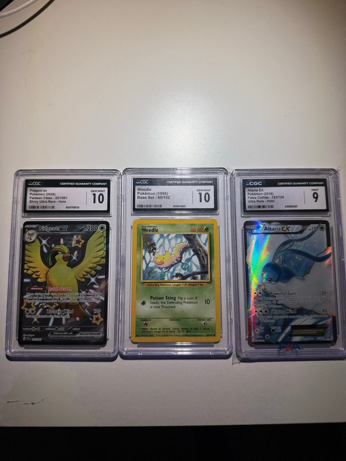 Pokémon CGC Graded Kaarten: Pidgeot, Weedle, Altaria EX, Ophalen of Verzenden, Zo goed als nieuw, Meerdere kaarten