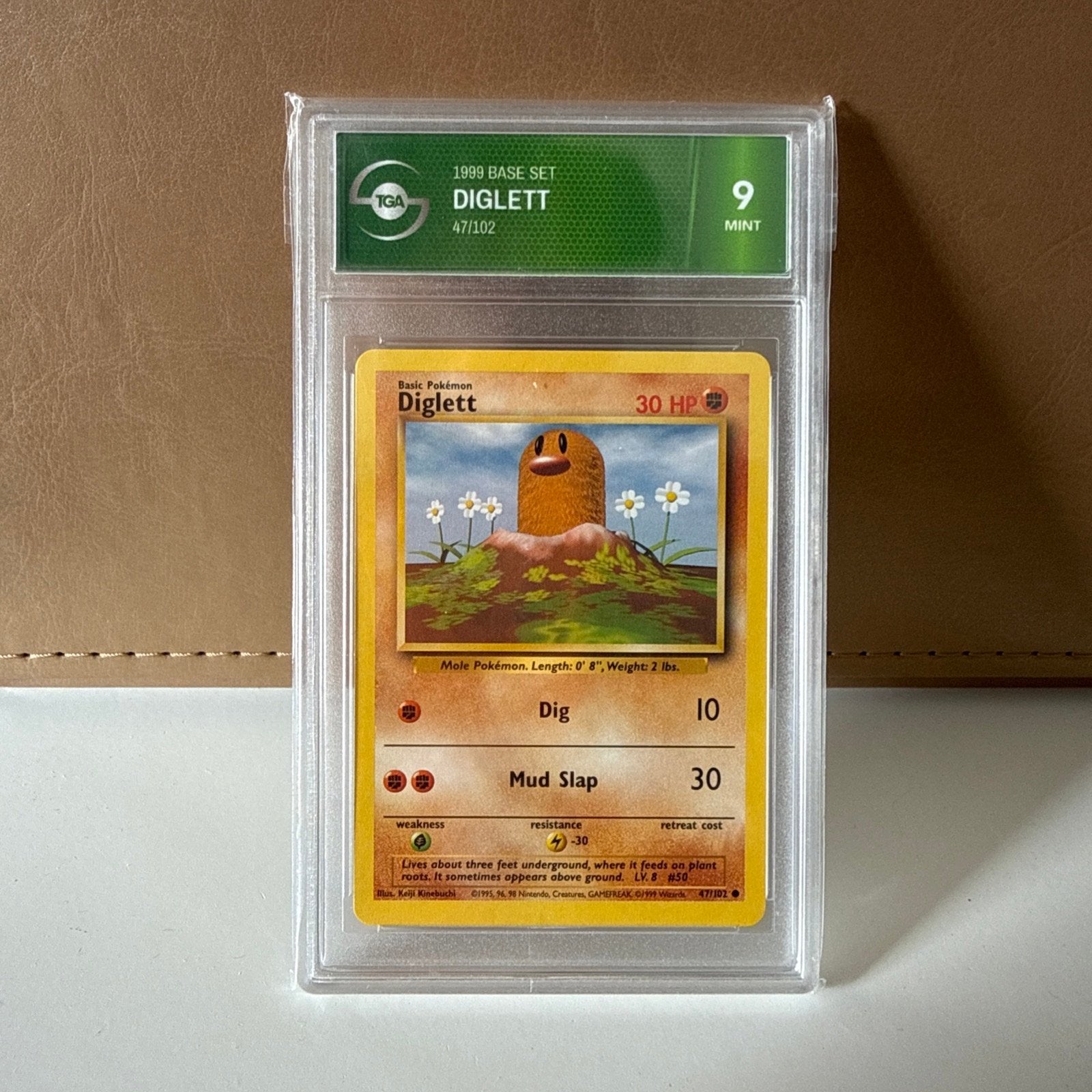 Pokémon Diglett 1999 Base Set TGA 9 Mint, Ophalen of Verzenden, Zo goed als nieuw, Losse kaart