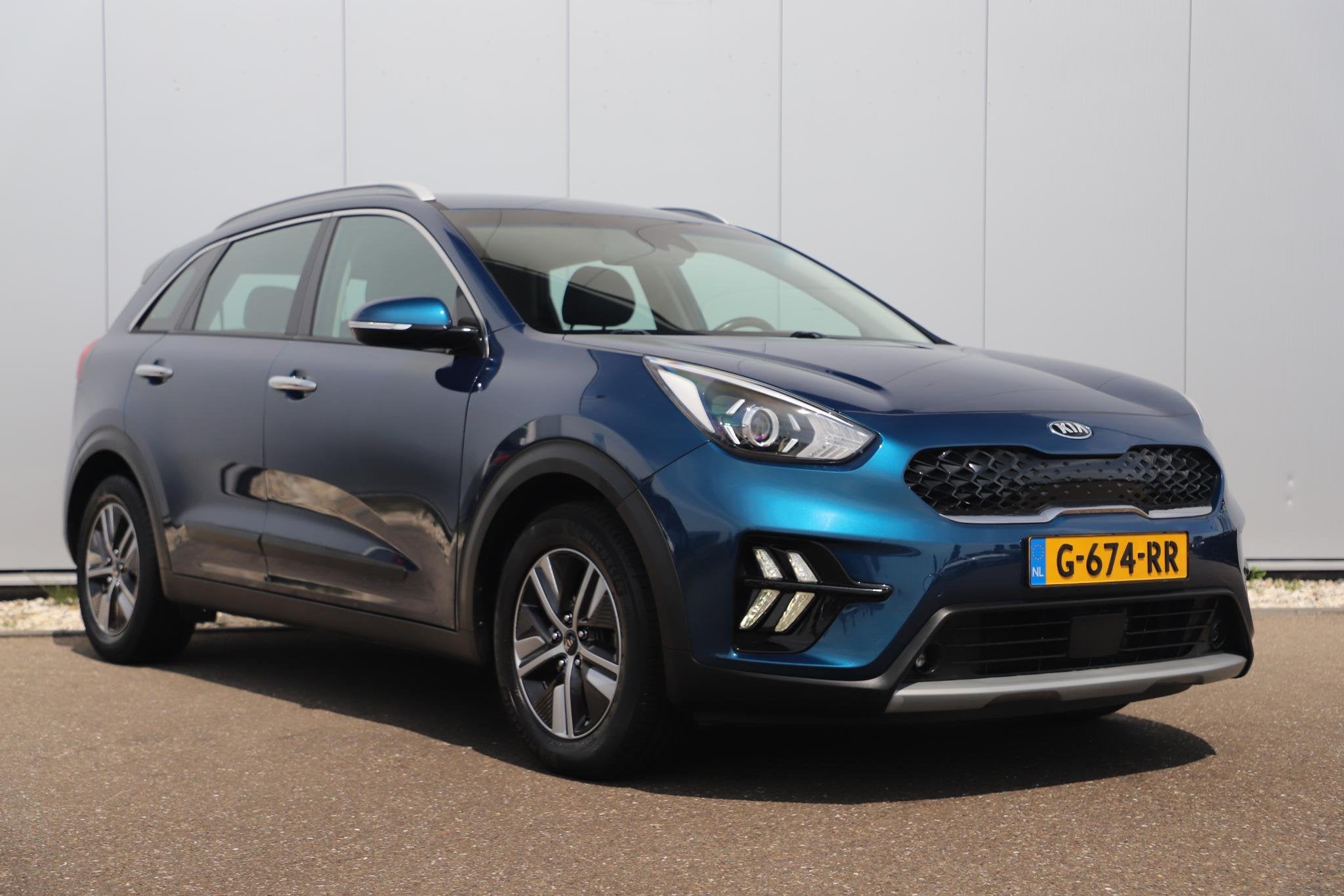 Kia Niro 1.6 GDi Hybrid DynamicLine Automaat Half Leder Navi, Auto's, Kia, Gebruikt, Euro 6, Blauw, Leder en Stof