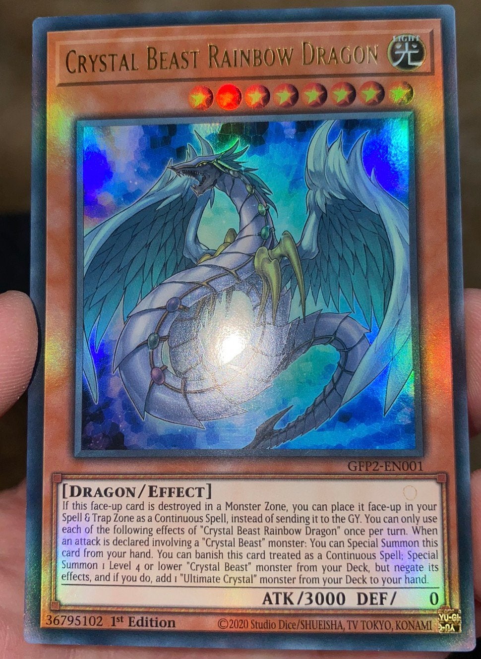 Yu-Gi-Oh! Crystal Beast Rainbow Dragon GFP2 1st Edition !, Ophalen of Verzenden, Zo goed als nieuw, Losse kaart, Foil