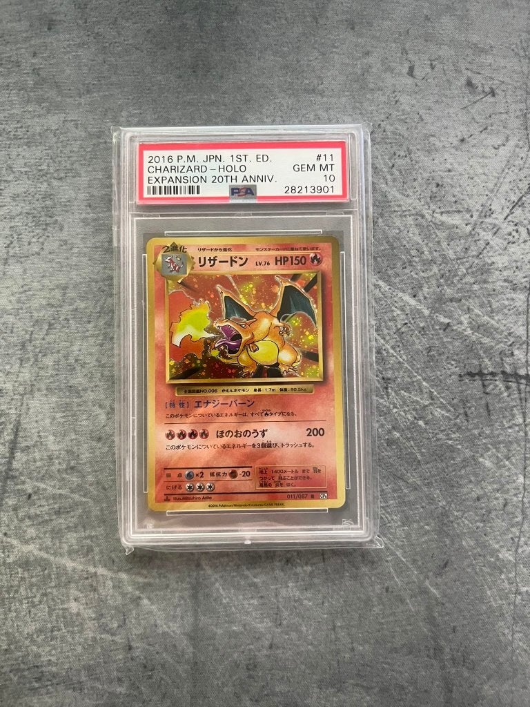 PSA 10 Charizard Holo 20th Anniversary 1st Edition Expansion, Ophalen of Verzenden, Nieuw, Losse kaart, Foil