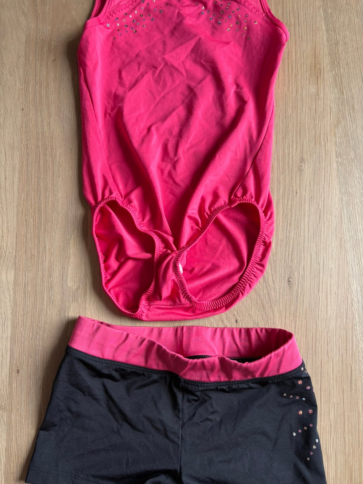 Turnpakje roze zwart maat 134, Sport en Fitness, Turnen, Kindermaat 122 t/m 140, Ophalen, Zo goed als nieuw, Turnpak(je)