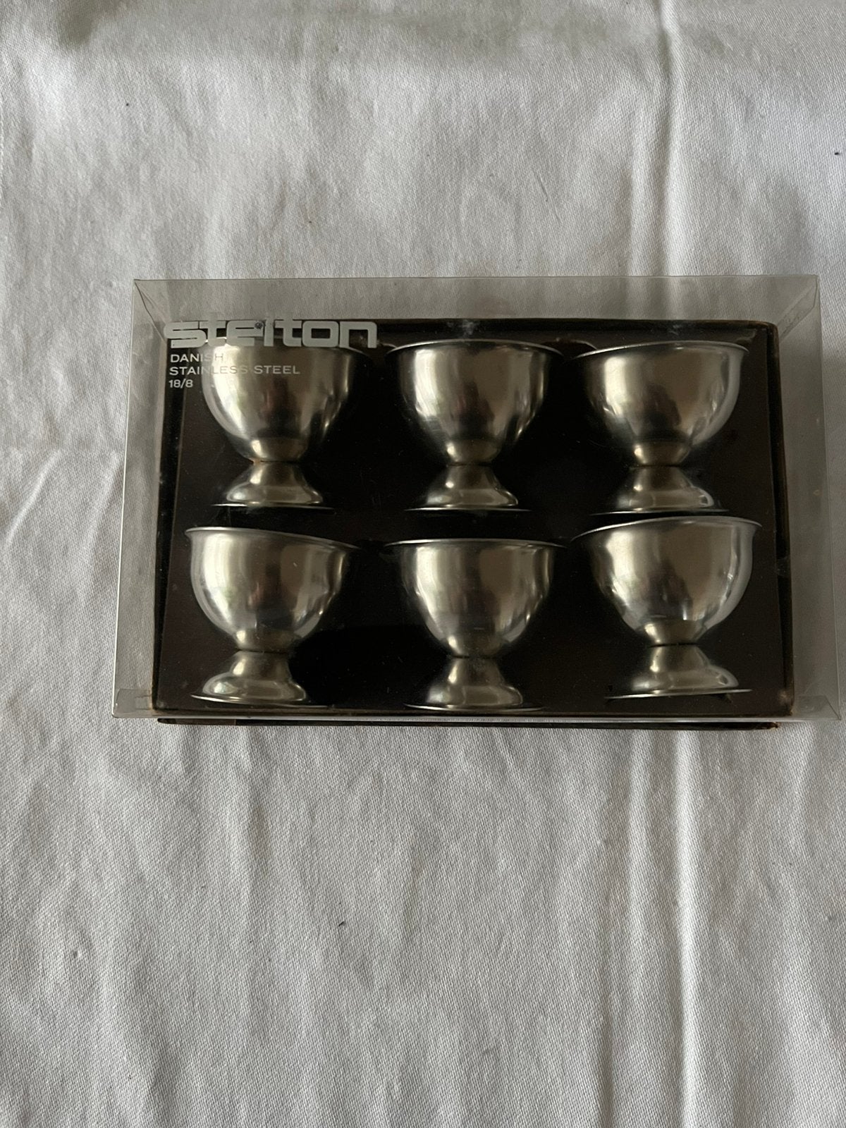 set van 6 Stelton eierdopjes in originele verpakking, Zilver, Ophalen of Verzenden, Metaal, Overige merken