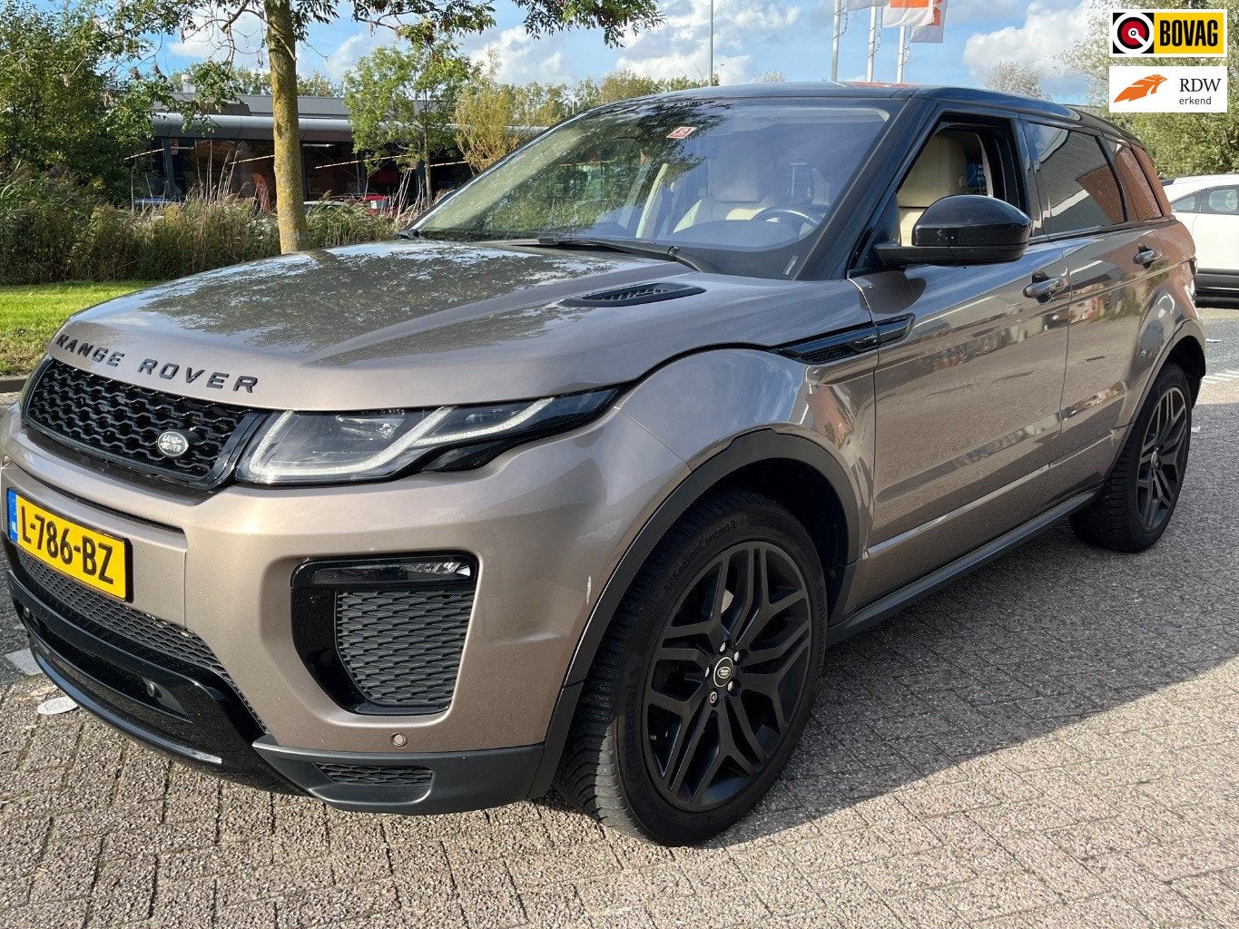Land Rover Range Rover Evoque 2.0 Si4 Autobiography, Navi, C, Auto's, Dealer onderhouden, 4 cilinders, Bruin, Leder