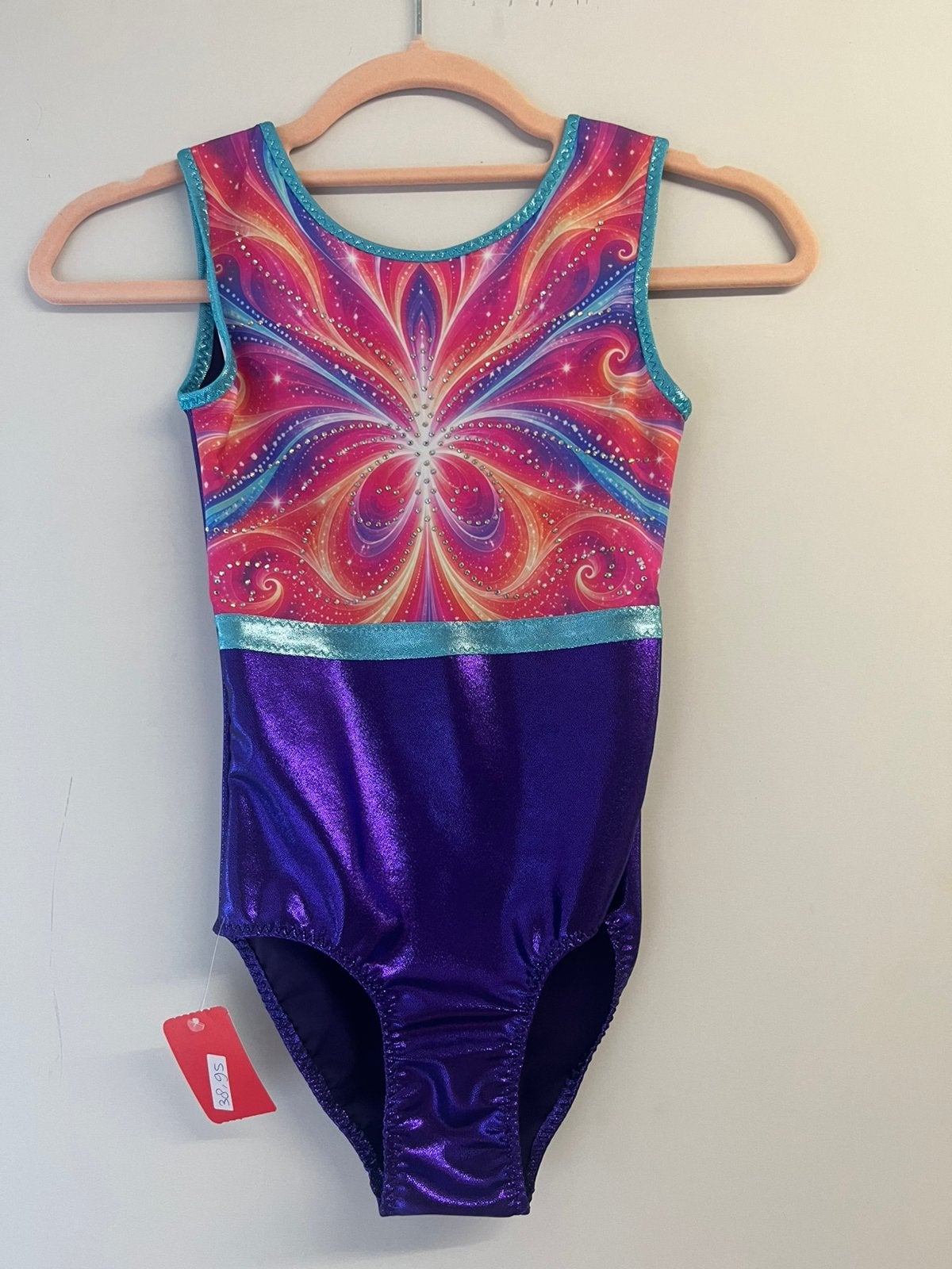 Nieuw turnpakje maat 128 - roze stralende print glitterpaars, Kindermaat 122 t/m 140, Ophalen of Verzenden, Nieuw, Turnpak(je)