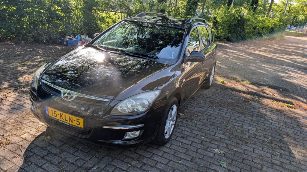 Hyundai i30 1.6 I Cvvt Crosswagon 2010 Zwart, Auto's, Voorwielaandrijving, 1591 cc, 4 cilinders, Zwart