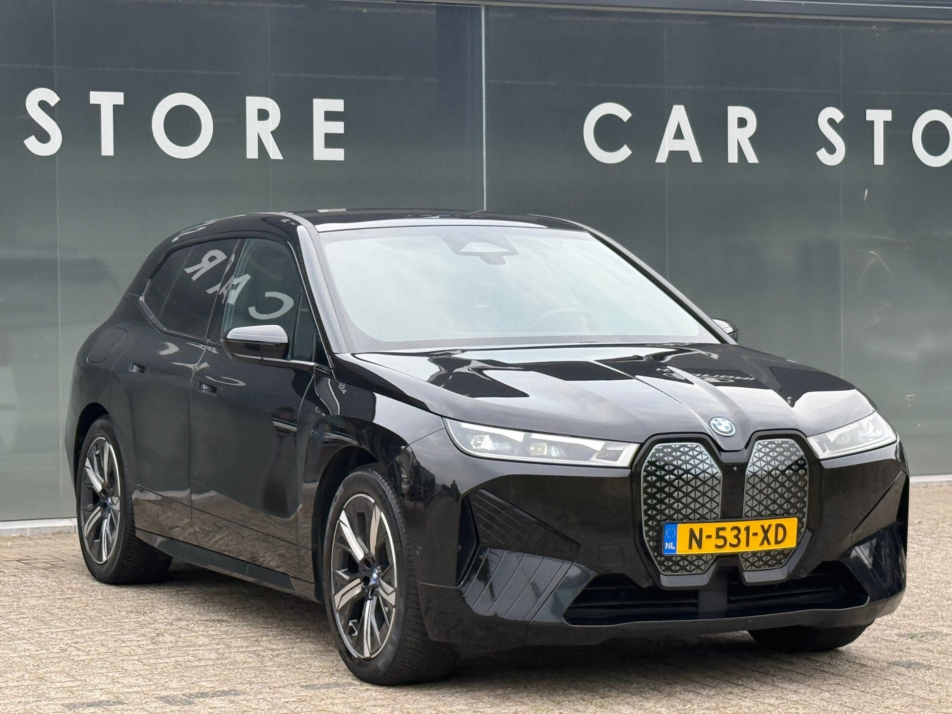 BMW IX XDrive40 High Executive 77 kWh 96% soh PANO|B&W|Trekh, Auto's, BMW, Automaat, Gebruikt, Zwart, Zwart
