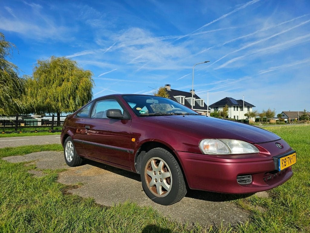 Toyota Paseo 1.5 I 1997 Rood, Auto's, 31 €/maand, 4 cilinders, 4 stoelen, Origineel Nederlands