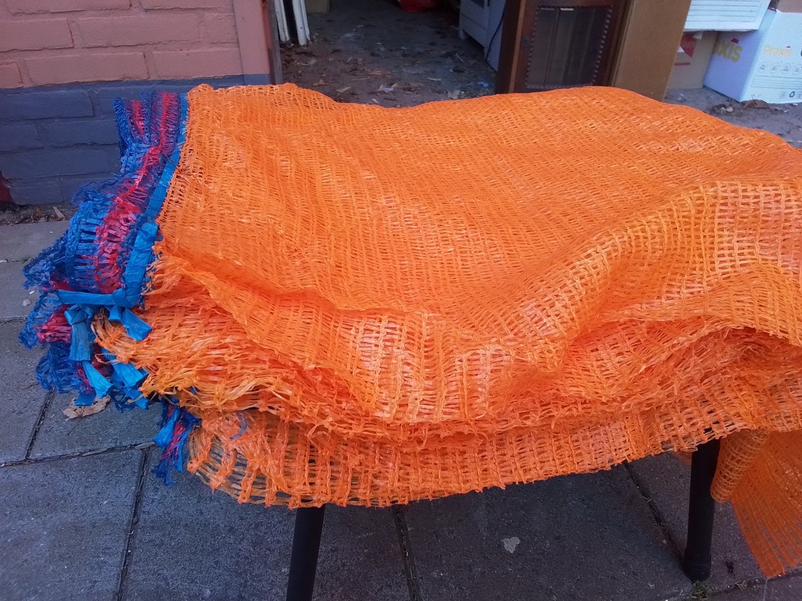 Honderden oranje netzakken/raschelzakken met trekkoord, Tuin en Terras, Ophalen of Verzenden, Nieuw