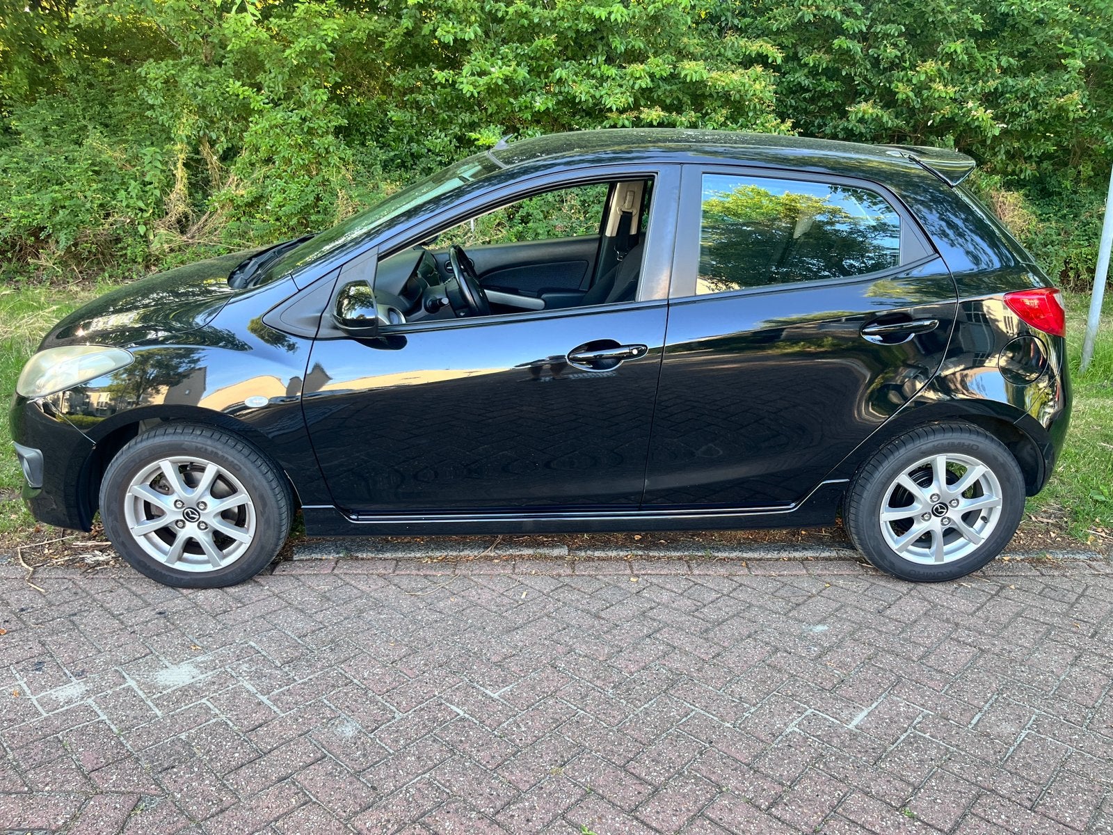 Mazda 2 1.5 76KW 5DRS 2009 Zwart, Auto's, Voorwielaandrijving, Stof, 1498 cc, 4 cilinders