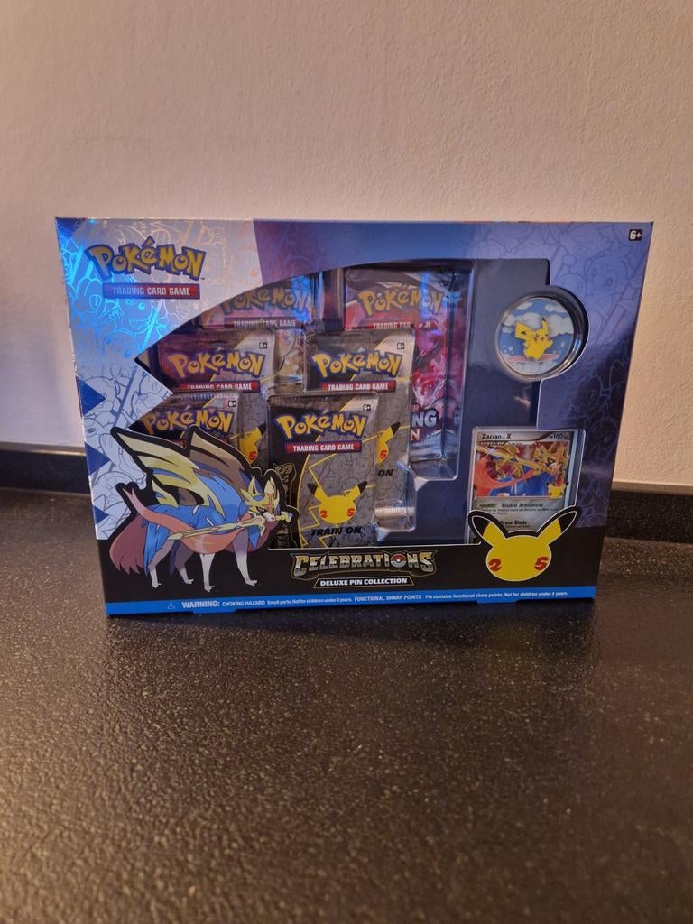 Celebrations 25 years deluxe pin Collection. Pokémon TCG, Ophalen of Verzenden, Nieuw, Boosterbox, Foil