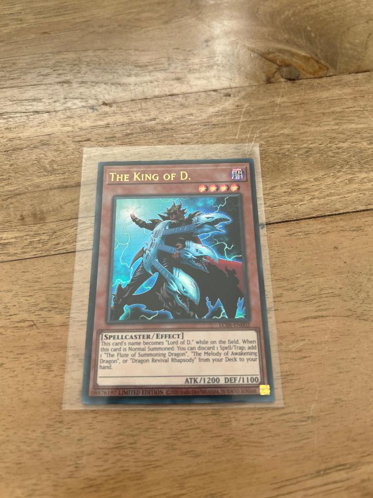 Yu Gi Oh! The King Of D. LQ06-EN002, Hobby en Vrije tijd, Ophalen of Verzenden, Nieuw, Losse kaart