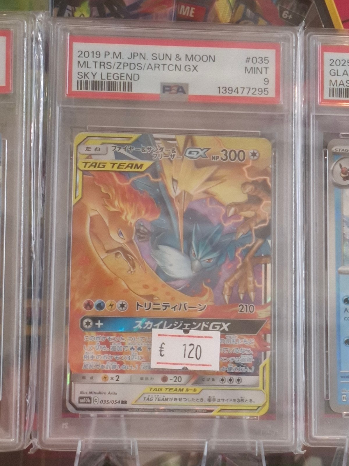 PSA 9 Mint Moltres & Zapdos & Articuno GX - Sky Legend #035, Ophalen of Verzenden, Nieuw, Losse kaart