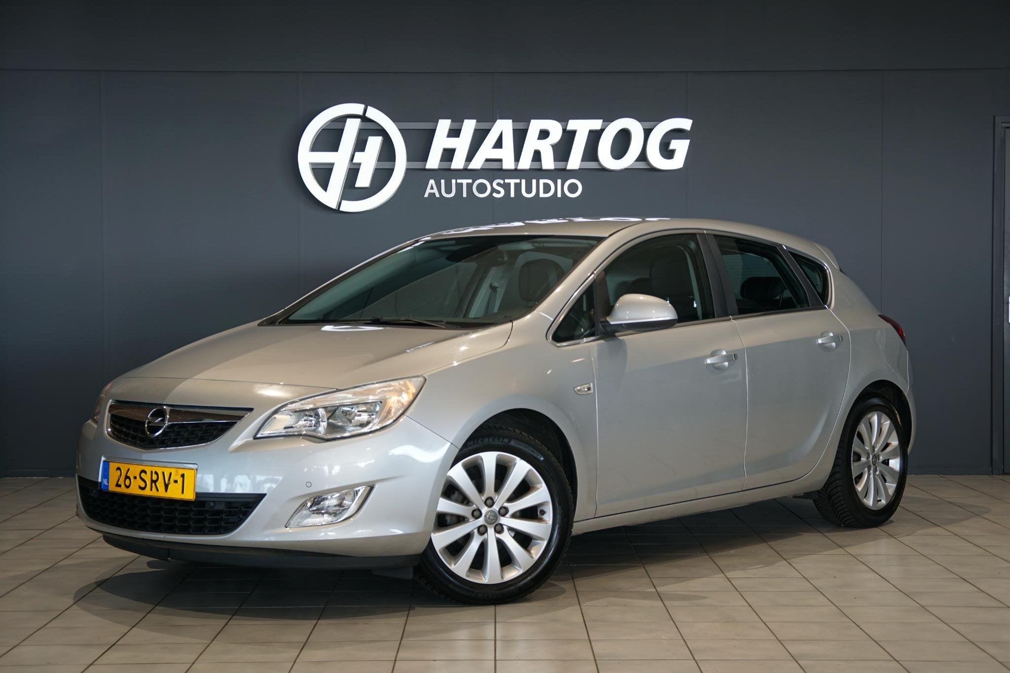 Opel Astra 1.4 Turbo Cosmo + TREKHAAK / SENSOREN / CLIMATE C, Auto's, Opel, Voorwielaandrijving, Euro 5, Stof, Gebruikt