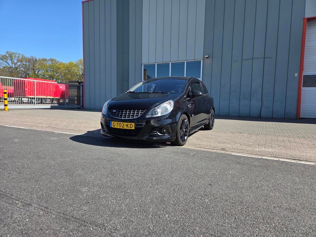 Opel Corsa 1.4 16V 3D WR 2009 Zwart, Auto's, Voorwielaandrijving, Stof, 40 €/maand, 4 cilinders