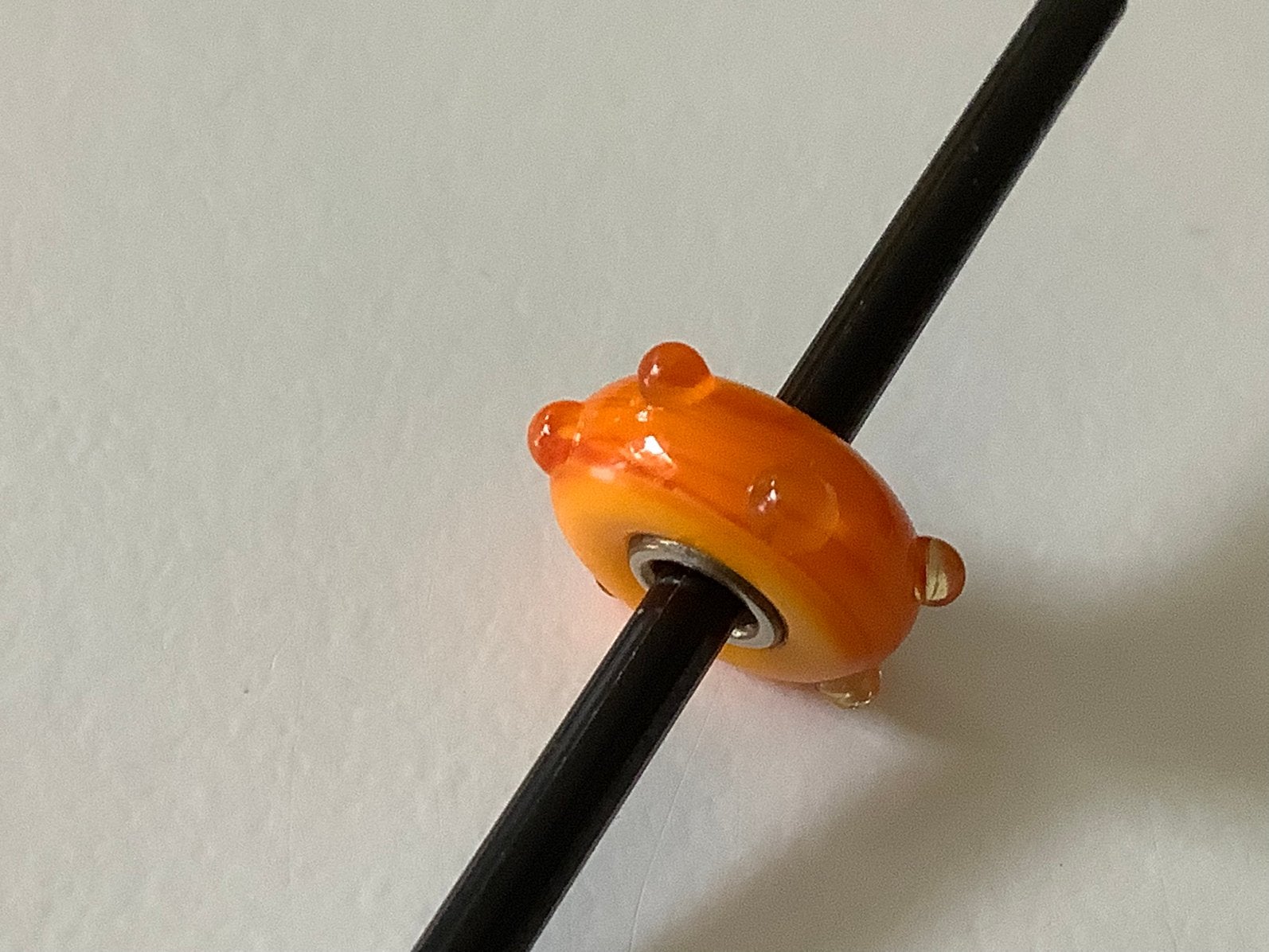 Trollbeads retired oranje met buds, leuk voor wk armband., Ophalen of Verzenden, Zo goed als nieuw, Trollbeads
