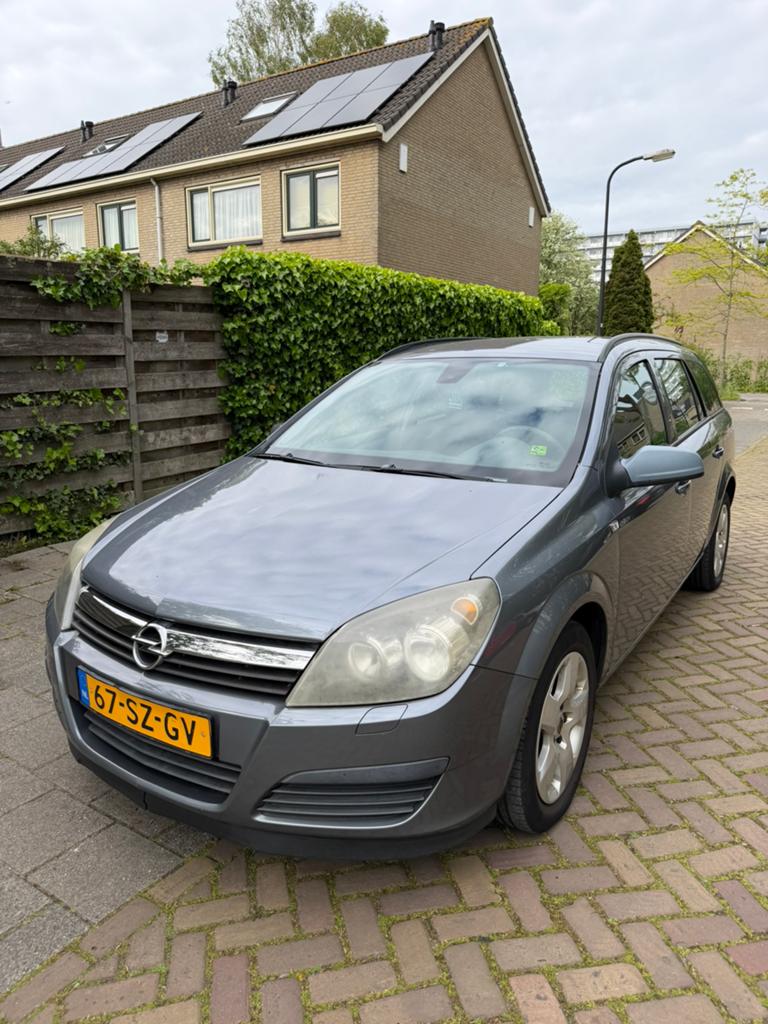 Opel Astra 1.4 16V St.wgn. 2006 Grijs, Auto's, Voorwielaandrijving, 4 cilinders, Origineel Nederlands, Stationwagon