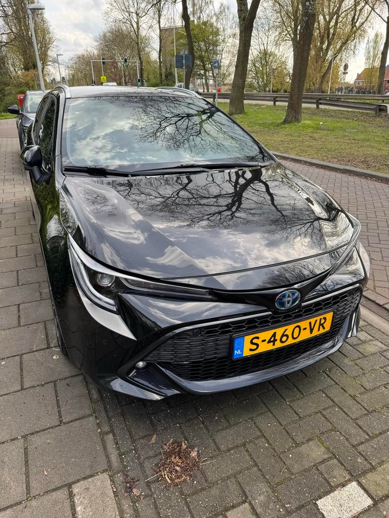 Toyota Corolla TS 2.0 Hybrid 193pk CVT 2022 Zwart, Auto's, Toyota, 1345 kg, Lichtsensor, Zwart, Stationwagon
