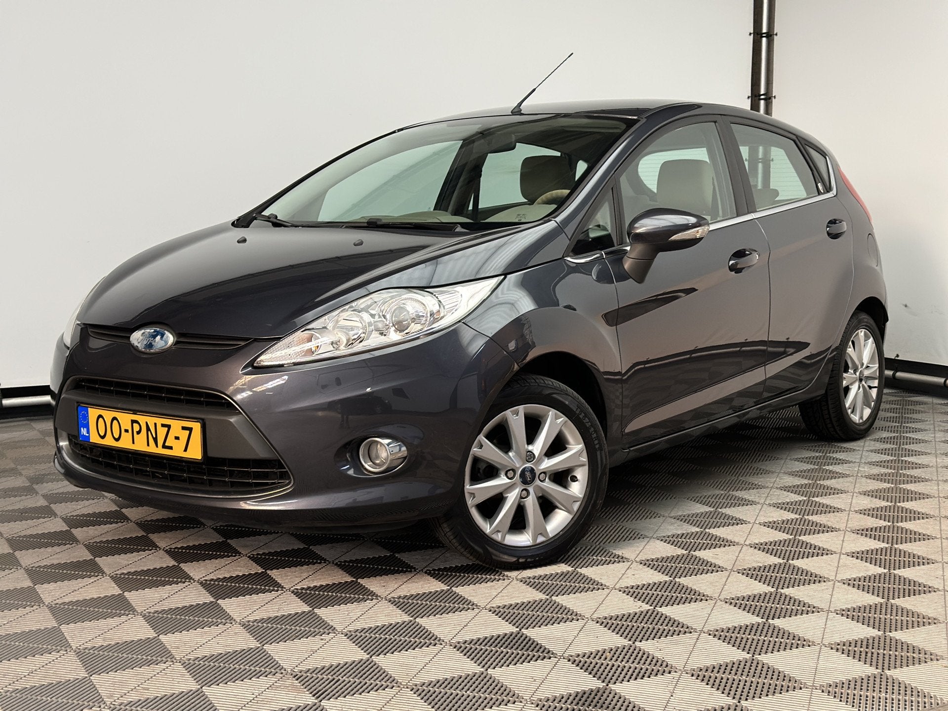 Ford Fiesta 1.25 Ghia 5-drs ECC LM15" NL Auto (bj 2011), Voorwielaandrijving, Euro 5, Stof, Met garantie (alle)