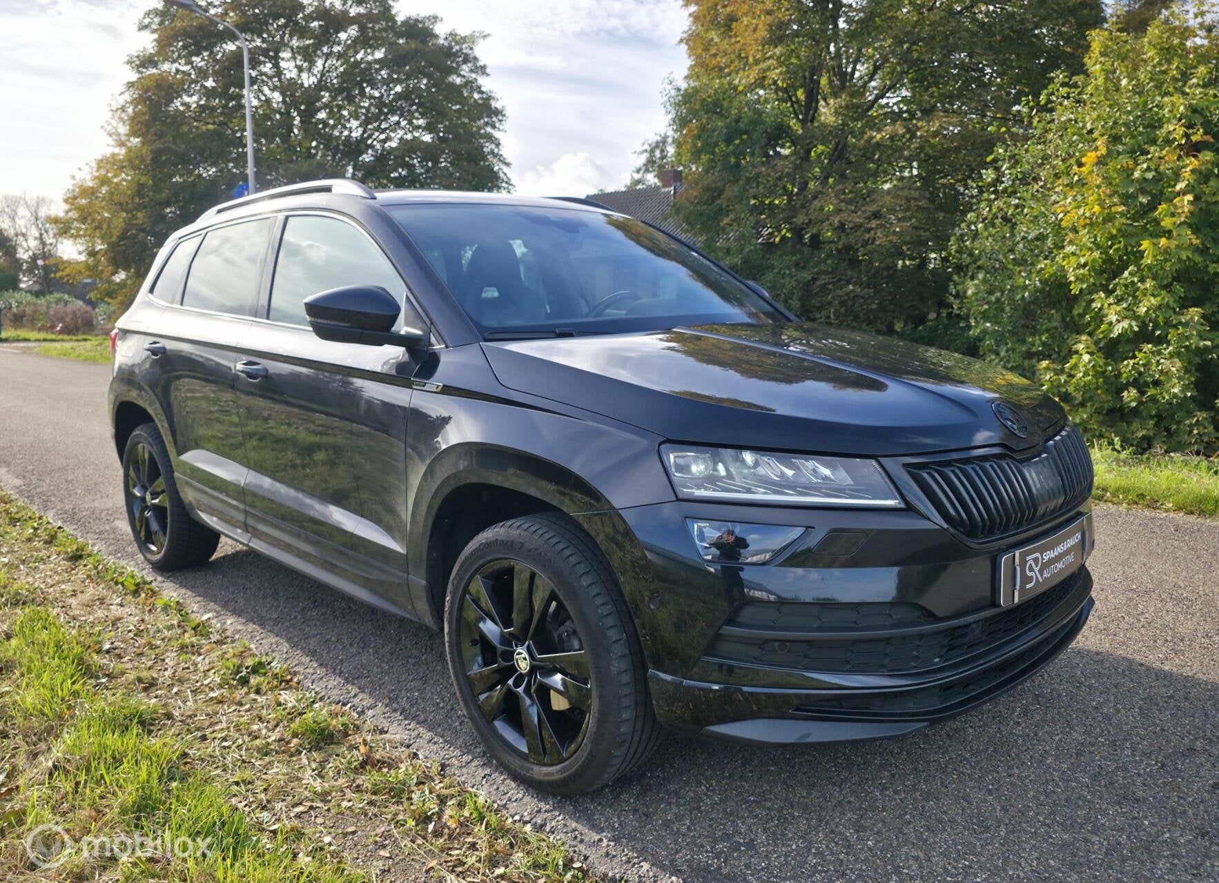 Skoda Karoq 1.5 TSI ACT Sportline / Canton / Leder / Camera, Auto's, 4 cilinders, 150 pk, Zwart, Bedrijf