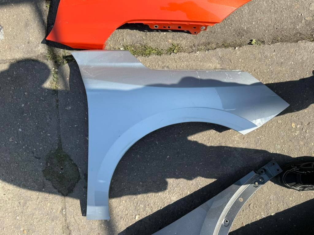 Opel Corsa F spatbord rechts, Ophalen of Verzenden