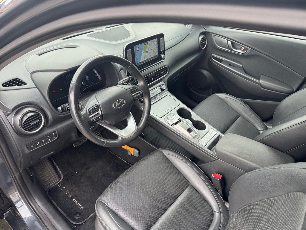 Hyundai KONA EV Premium+ 64 kWh- SOH 99%, Stuur/Stoelverwarm, Auto's, Hyundai, 14 kWh, Gebruikt, Met garantie (alle), 575 min