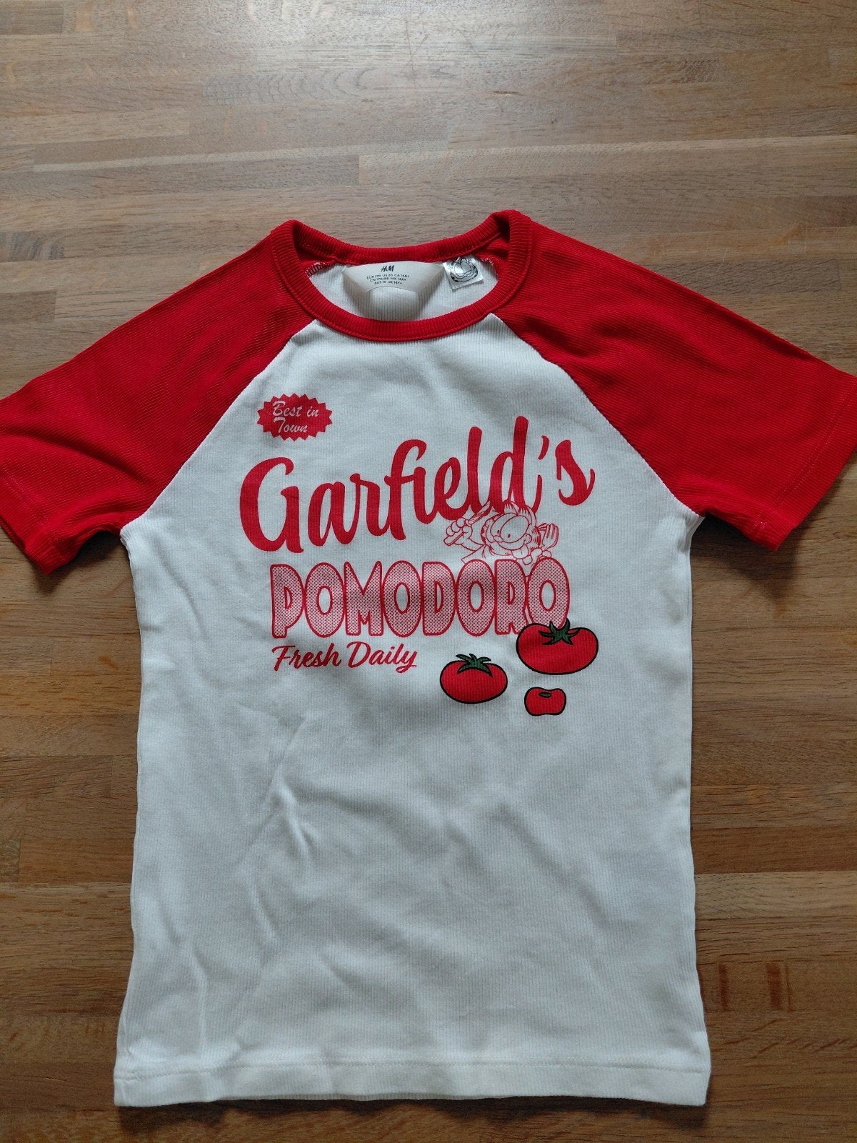Als nieuw shirt Garfield  H&M draagmaat 152/158 1 euro, Kinderen en Baby's, Kinderkleding | Maat 152, Meisje, H&M, Ophalen of Verzenden