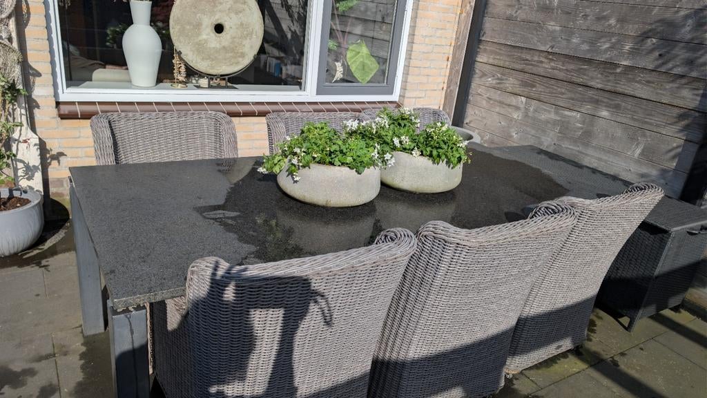 Natuurstenen eettafel met 6 rieten stoelen, Tuin en Terras, Tuintafels, Ophalen, Rechthoekig, Overige materialen