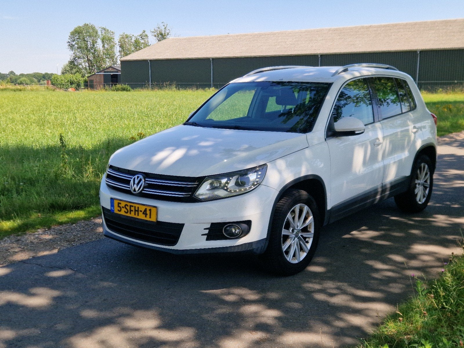 Volkswagen Tiguan 1.4 TSI 90KW XENON CRUISE TREKHAAK NAVI, Voorwielaandrijving, 15 km/l, 4 cilinders, Handgeschakeld