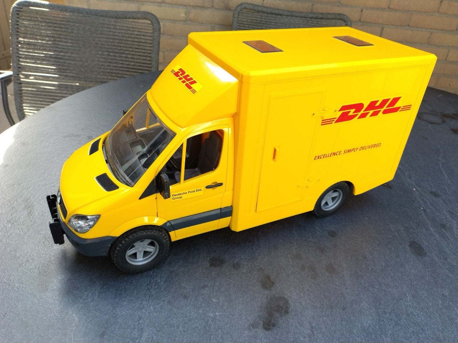 Bruder DHL bus - Mercedes Benz Sprinter, Kinderen en Baby's, Speelgoed | Speelgoedvoertuigen, Ophalen, Gebruikt