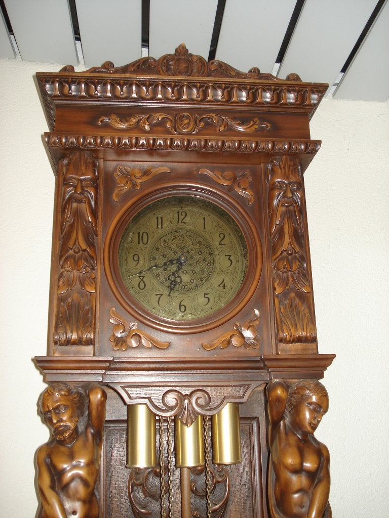 staande klok hout snijwerk, Ophalen