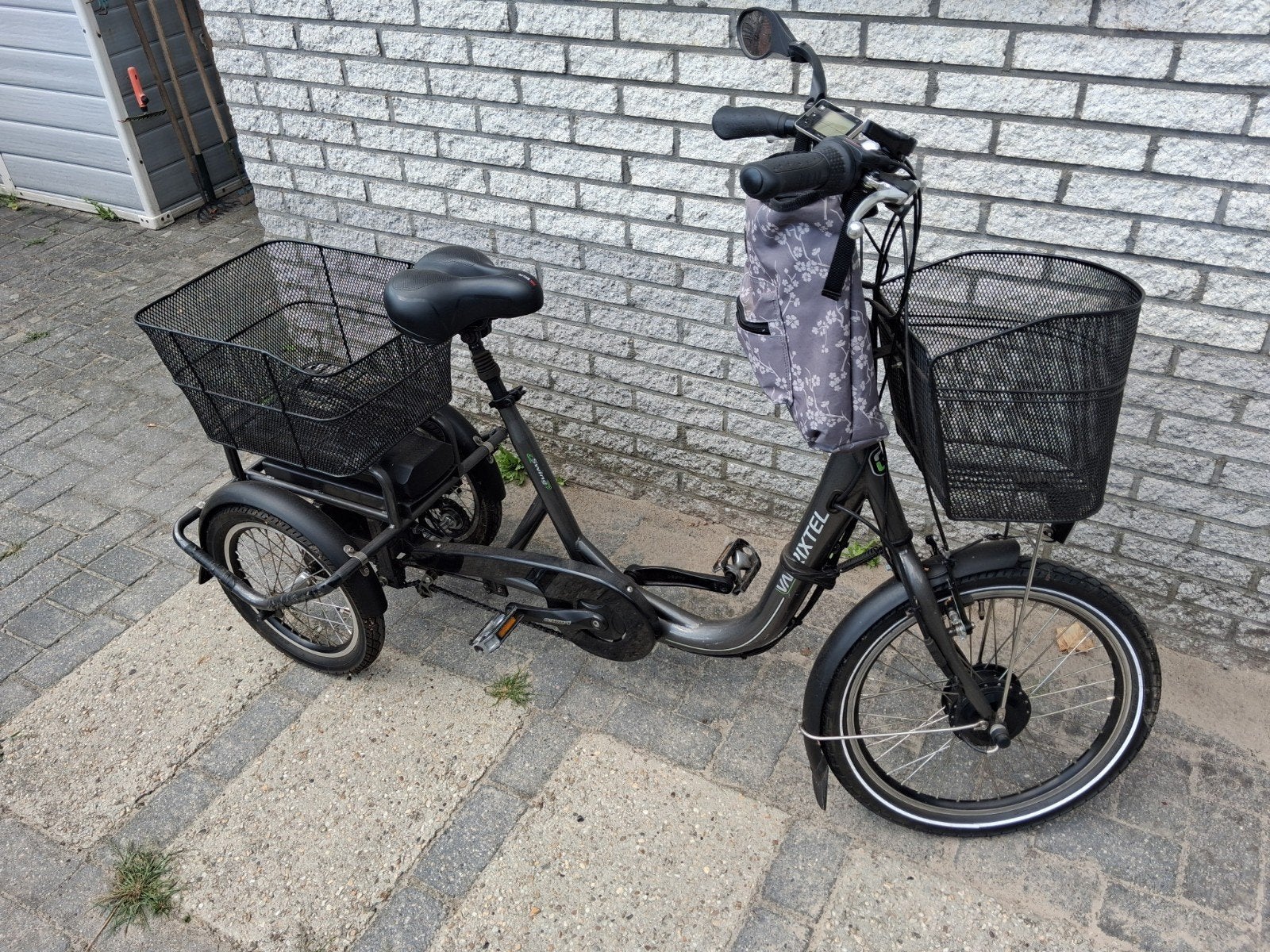 Van Rixtel elektrische driewieler met manden, Ophalen