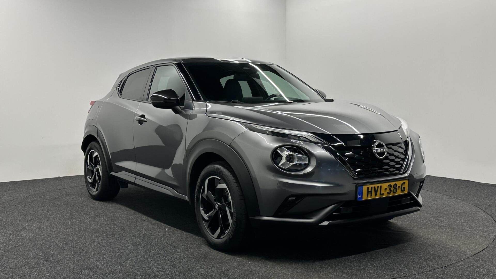 Nissan Juke 1.6 Hybrid Business Design TREKHAAK CARPLAY NAVI, Auto's, 1300 kg, Gebruikt, Met garantie (alle), Leder en Stof