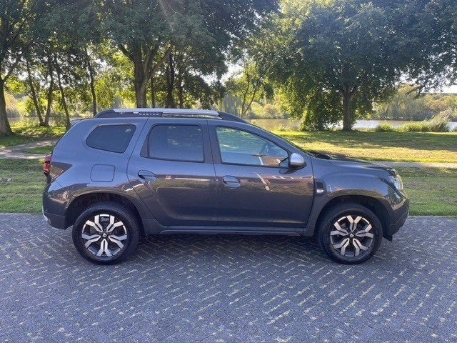 Dacia Duster 1.0 Tce 100pk Bi-fuel 4x2 2021 Grijs, Auto's, Voorwielaandrijving, Dealer onderhouden, Stof, Duster
