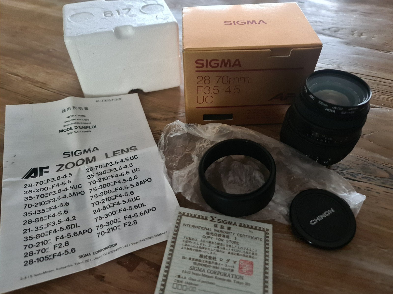 Sigma UC zoom 28-70 mm lens met zonnekap F3.5-4.5 Hoya, Sigma, Zo goed als nieuw, Zoom, Telelens