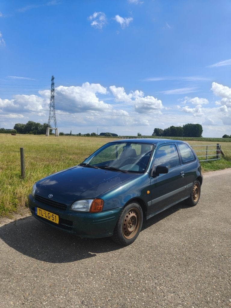 Toyota Starlet 1.3 16V AUT 1998 Groen, Auto's, Toyota, Stof, 74 pk, 4 cilinders, 400 kg