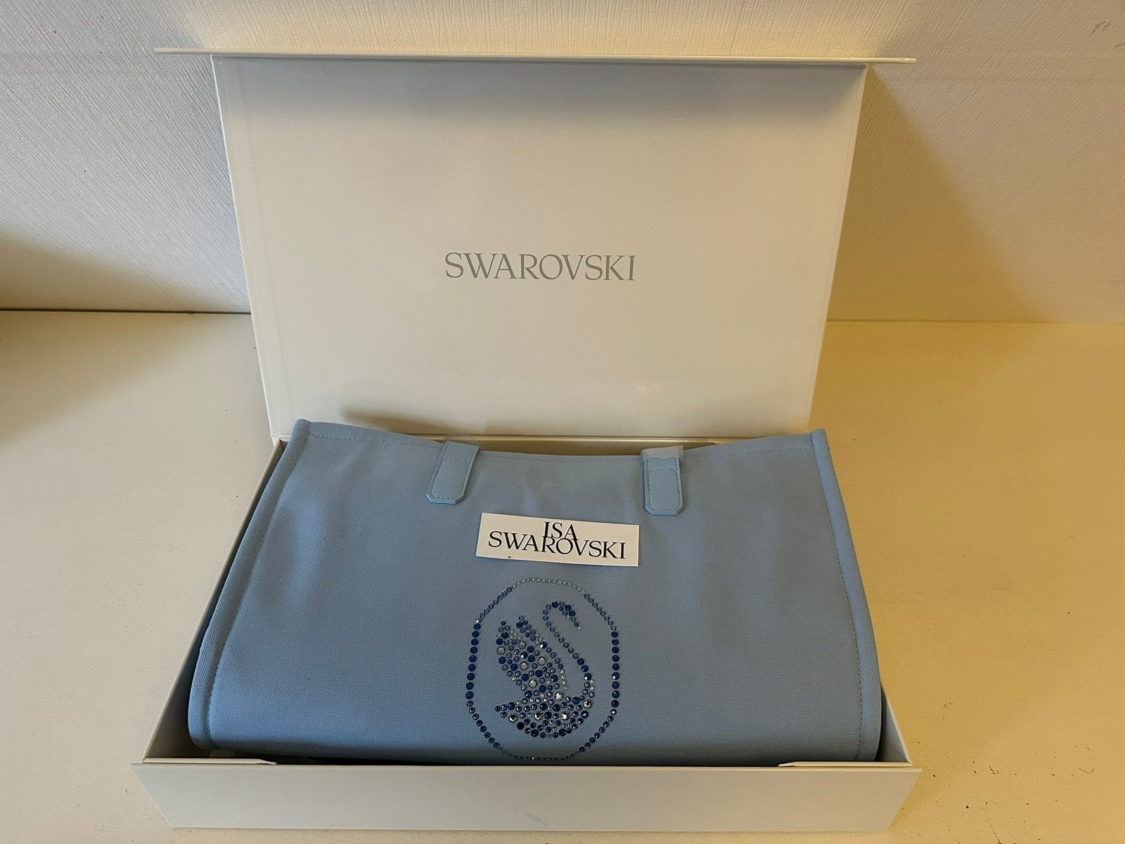 Nieuw in doos , Mooie grote blauwe tas van Swarovski, Ophalen of Verzenden, Nieuw, Figuurtje