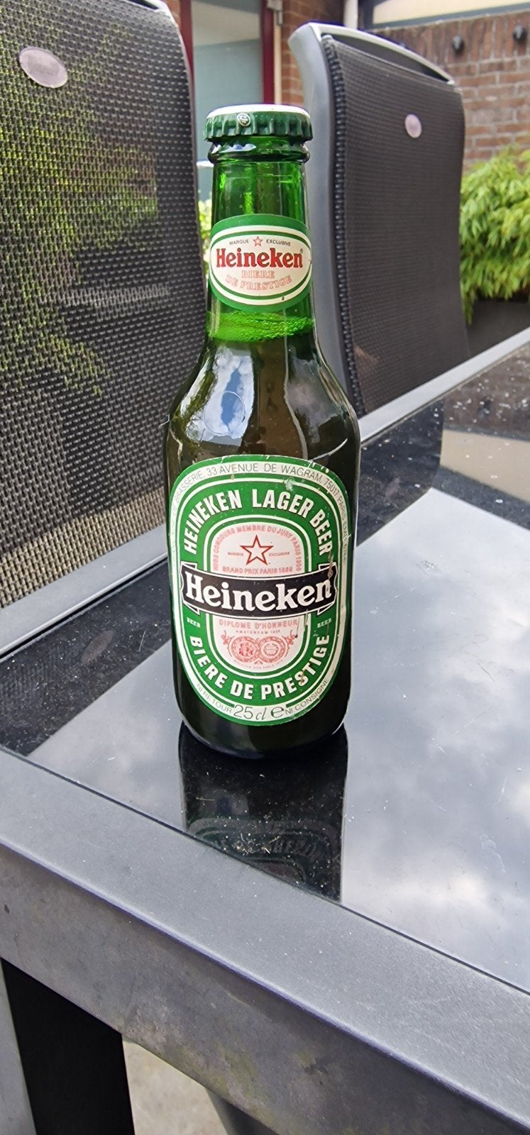 Heineken oud  bierfles met in houd ongeopend, Ophalen of Verzenden, Flesje(s), Heineken