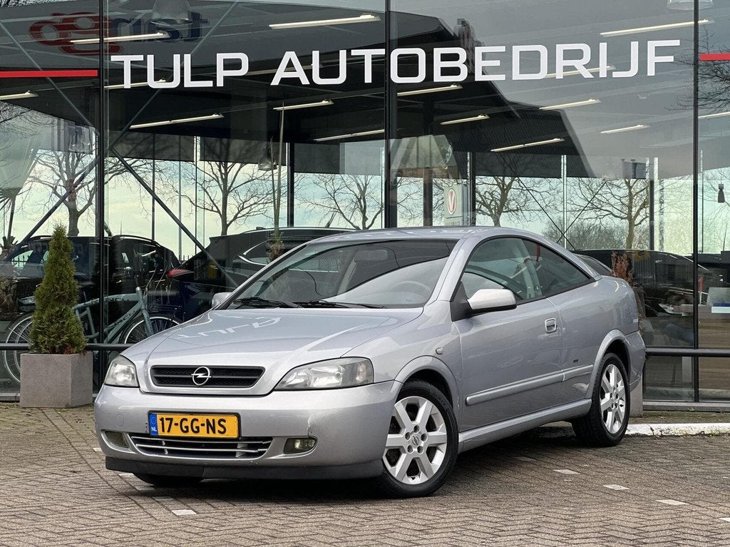 Opel Astra Coupé 1.8-16V Airco Lage km stand NAP, Auto's, 1160 kg, Stof, Zwart, 4 cilinders