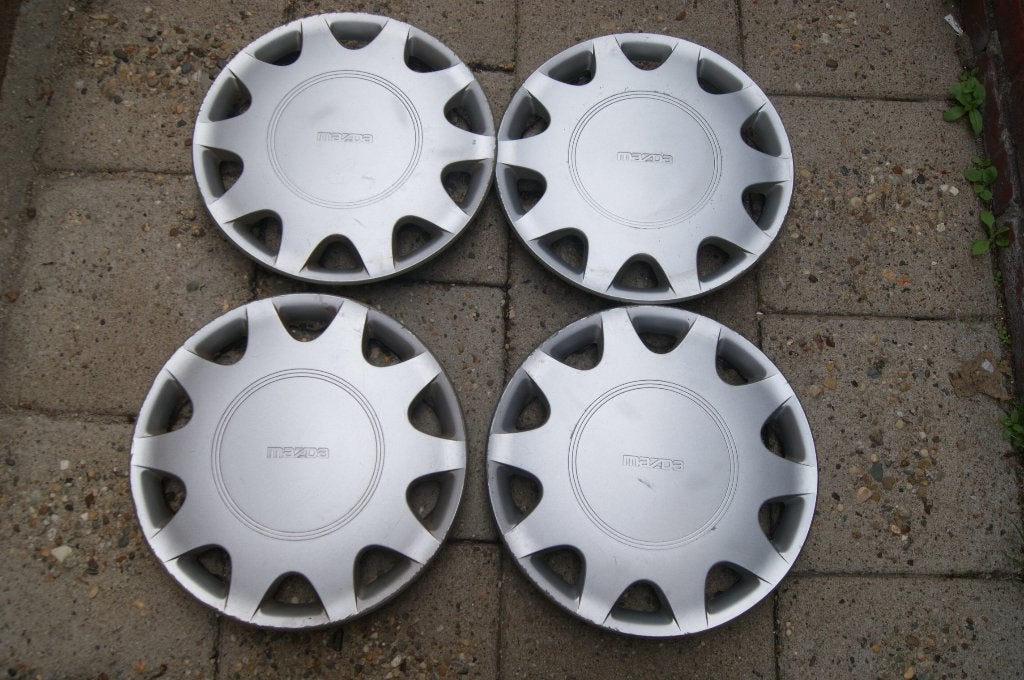 Set van 4 originele wieldoppen Mazda 323 13 inch, Ophalen of Verzenden, Gebruikt