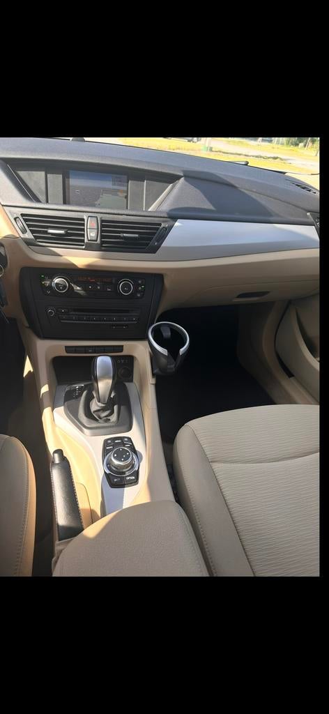BMW X1 2.0 D Sdrive 18D AUT 2011 Bruin, Auto's, Achterwielaandrijving, Bruin, Origineel Nederlands, Diesel