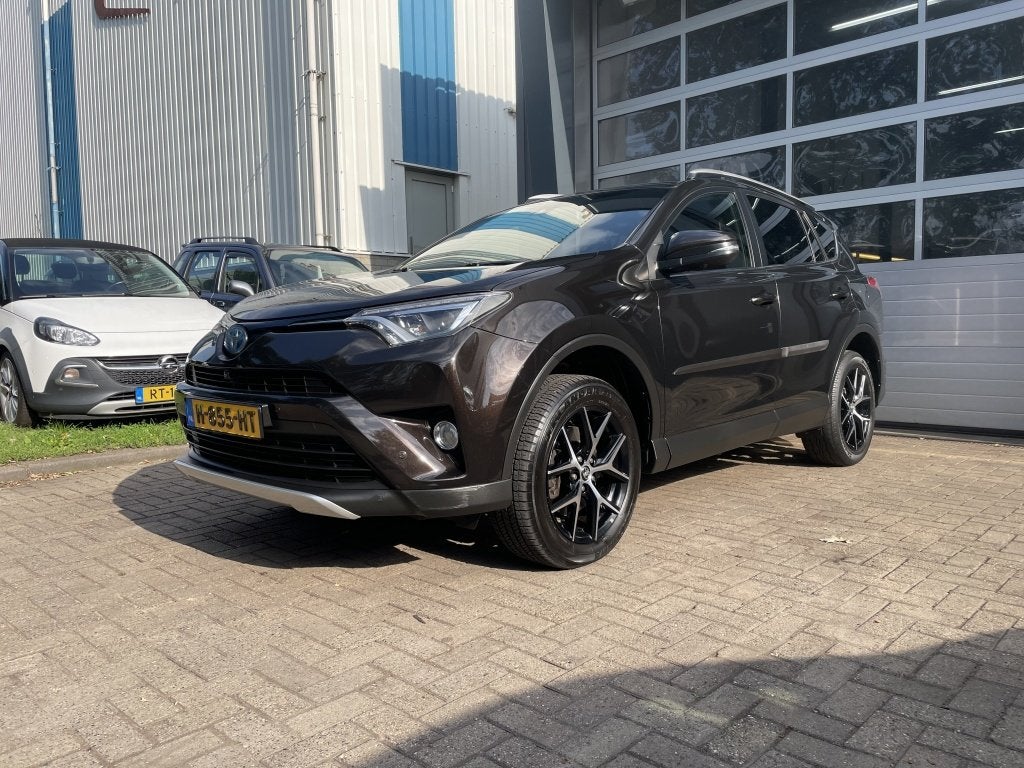 Toyota RAV4 2.5 Hybrid Executive Business (bj 2016), Auto's, Dealer onderhouden, Gebruikt, Euro 6, Bruin