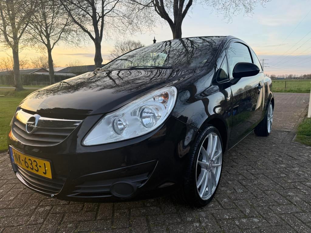 Opel Corsa 1.2 16V 2010 nieuwe APK, 17 inch, Carplay, SubW, Stof, Zwart, Metallic lak, Handgeschakeld