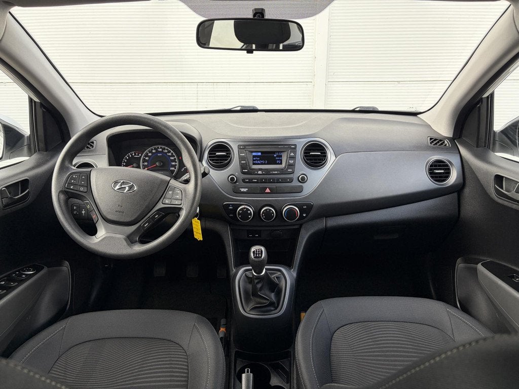 Hyundai i10 1.0i Comfort / Airco / Cruise control /, Auto's, Hyundai, Stof, Gebruikt, 4 stoelen, Wit