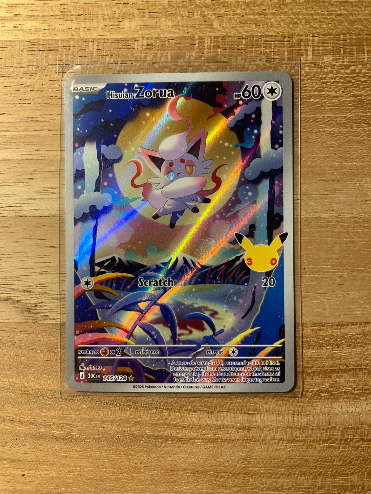 Pokemon Kaart Hisuian Zorua 145/128 - 30th Celebration, Hobby en Vrije tijd, Ophalen of Verzenden, Zo goed als nieuw, Losse kaart