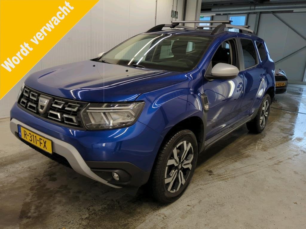 Dacia Duster 1.3 TCe Prestige Trekhaak | Camera, Auto's, Stof, Gebruikt, 4 cilinders, Blauw