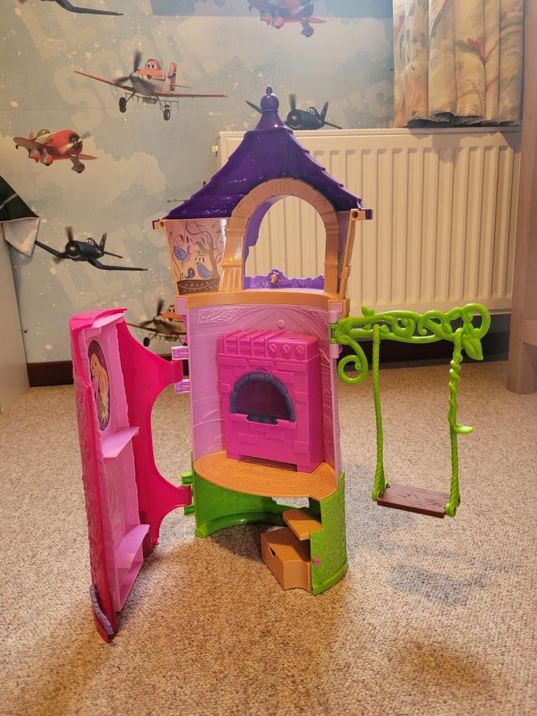 Roze en paarse speelgoedtoren met schommel, Ophalen